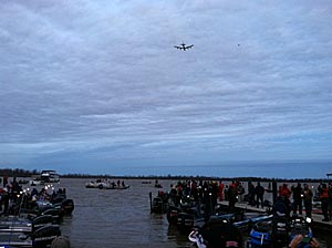 A B-52 from Barksdale Air Force Base flies over the crowd at the launch on Day 1 of the Bassmaster Classic Friday.