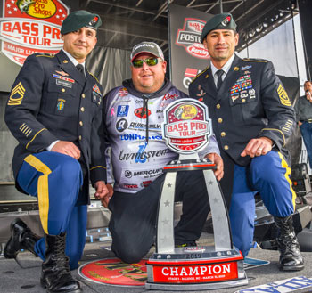 It was a proud finish to Championship Sunday at Raleigh for Jacob Powroznik, as he poses with Fort Bragg, N.C., infantry and his Stage Three trophy