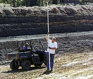 That black soil, stockpiledfor lining a pond, was compactible. It was also fatal for fish, until we figured it out.