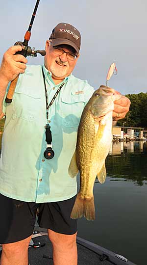 Missouri angler Tom Murphy relies on a flutter spoon to catch bass hanging below shad balls during late summer.