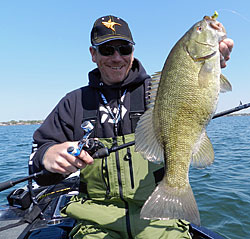 Joe Balog with a hefty Lake St. Clair smallmouth caught on a swimbait.