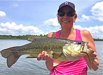 Stacy Vobach with a lunker largemouth taken from a small lake in Kansas. Images by Dave Jerome and Stacy Vobach