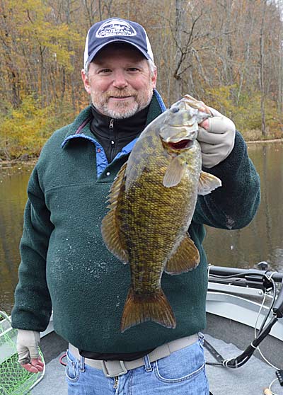 November is a great month for catching smallmouth, which school tighter and feed on baitfish more as the water temperature drops. A jig and minnow will catch them. Photo by Pete M. Anderson