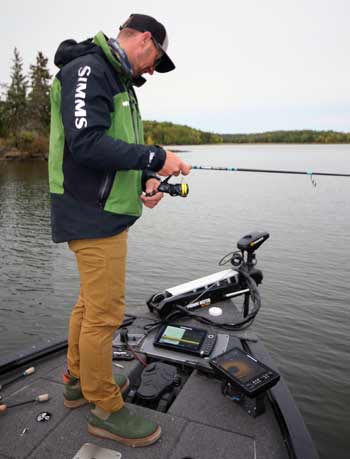 Bassmaster Elite Series angler Jeff Gustafson uses a relatively short rod — 6-feet and 10-inches long — for vertically fishing a drop shot. It keeps his lure closer to his boat and inside his electronics’ transducer’s cone, where he can keep an eye on it and pursuing smallmouth. Photo courtesy of Jeff Gustafson