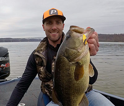 Guide and tournament angler Travis Manson chases tidal bass year-round on Maryland’s Chesapeake Bay. When its waters turn icy late fall through early spring, he catches many on a slow-moving blade bait. Photo courtesy of Travis Manson