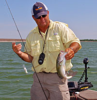 When water levels drop in western Nebraska reservoirs during the summer largemouths are restricted to open water where crankbaits excel.