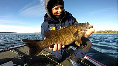 Fall smallmouth set up on shallow points and humps that are windblown to feed on baitfish in the fall. Photo courtesy of Brad Paradis