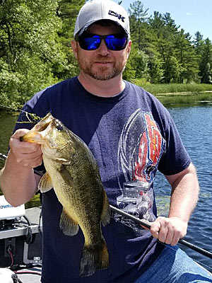 When the water is high, bass have room to roam. But as it falls, they are forced to abandon shallow-water haunts and converge on spots in slightly deeper water. Photo by Pete M. Anderson