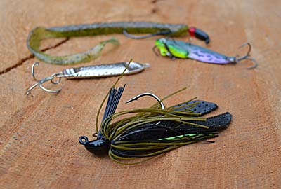 The traditional silicone or living rubber bass jig is bass fishing's most versatile lure. Learn to use it. It's an easy and quick move to catch bass on blade baits, jigging spoons, and Texas-rigged soft plastics. Photo by Pete M. Anderson