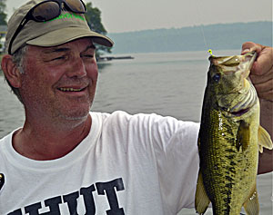 The author used light spinning gear and a tiny jig to flip under a dock where this bass was hiding.