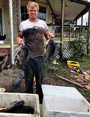 The aftermath, a muddy Tim Stewart and coolers of fish destined for dinner.