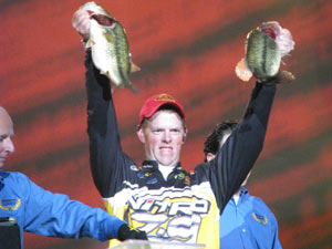 Jami Fralick holds up two fish during the weigh in on Day Two of the 2009 Bassmaster Classic.