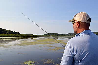 Thick mats of aquatic vegetation can be intimidating to fish at first glance. But the right approach, lures, and gear makes fishing them easier and more productive. Photo by Pete M. Anderson