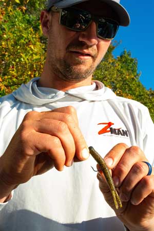 Bassmaster Elite Series angler Jeff Gustafson fishes a Ned Rig at home in Canada and is on the road for tournaments. He almost exclusively rigs it with Z-Man’s Hula StickZ. He finds it easier to rig straight, helping him drop it directly on bass and cover that he sees on his forward-facing sonar. Photo by Pete M. Anderson