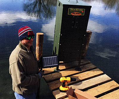 Installing our solar feeder on Bob Jones Lake.