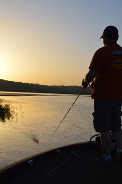 Every bass angler loves fishing topwater lures because of the explosive strikes they elicit. One of the best times to throw them is from post spawn through early summer. Photo by Pete M. Anderson