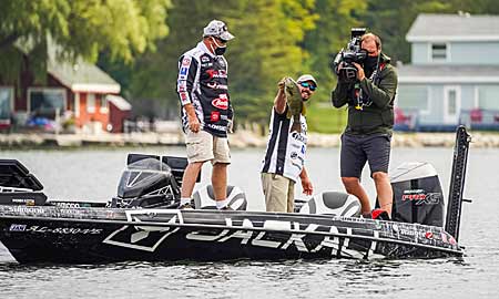 Keeping big bass hooked on crankbaits can be a chore. Major League Fishing Tackle Warehouse Pro Circuit angler Alex Davis makes it easier by using a slow-action rod. Its parabolic bend maintains pressure on bass, whether they are surging or jumping.  Photo courtesy of MLF / Photo by Ron Matsuura