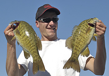 Matt Gnatkowski with a pair of smalmouths