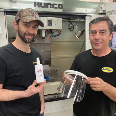 PRADCO Fishing's Travis Watson (left) and Gerald Winters were among the many employees who contributed to a company-wide effort to react quickly in response to the medical community's call for much needed supplies, using their Fort Smith in-house manufacturing capabilities to produce hand sanitizer and face shields.