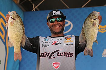 Searching around your boat is as important as looking under it in shallow water. Major League Fishing angler Mark Daniels Jr. uses the Panoptix function on his Garmin units to find submerged cover from a distance, reducing the chances of spooking the bass swimming around it. Photo courtesy of B.A.S.S. / Seigo Saito