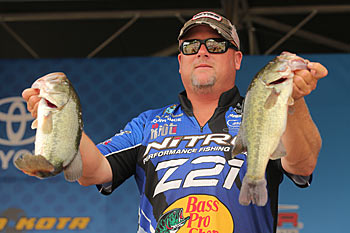 Bassmaster Elite Series angler Jamie Hartman always has one eye on the weather forecast. When he sees an approaching cold front, he works on developing deep-water patterns so he can keep catching bass after it arrives. Photo courtesy of B.A.S.S. / Seigo Saito