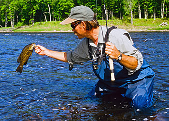 Dan Donarski lips a summer smallmouth caught on a nymph and a fly rod.