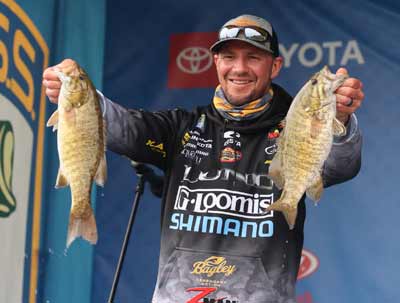 Bassmaster Elite Series angler Jeff Gustafson believes bass in fall react to less daylight by feeding more and moving toward their wintering hole. Anglers can keep up with them by watching the water temperature. Photo courtesy of B.A.S.S. / Seigo Saito