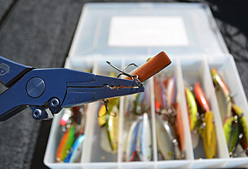 Invest in a pair of split-ring pliers for your boat, and use them to change treble hooks. You might get away with using another hook to open split rings for a while, but it takes longer and increases the risk of being hooked. Photo by Pete M. Anderson