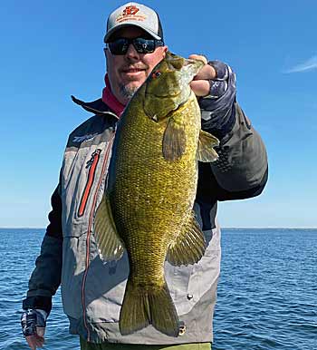 Plenty of Oneida’s smallmouth are caught on small swimbaits that imitate yellow perch and other local baitfish. But as gobies have found a foothold in the largest lake entirely within New York, the Ned rig is playing a bigger role in successful trips. Photo courtesy of Bill Lortz/N.Y. North Country Bassin’ Guide Service