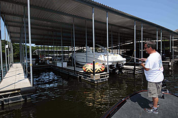 Shady areas of docks are the prime spots to throw a shaky head jig and finesse worm for suspended bass during the middle of a hot summer day.