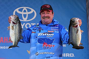 Once Bassmaster Elite Series angler Shaw Grigsby determines the depth that winter baitfish and bass are using, he uses his electronics to find patches of hard bottom there. Rocks, which cool slowly, offer slightly warmer water and plenty of crevices that are home to crawfish and other prey. Photo courtesy of B.A.S.S. / Gary Tramontina