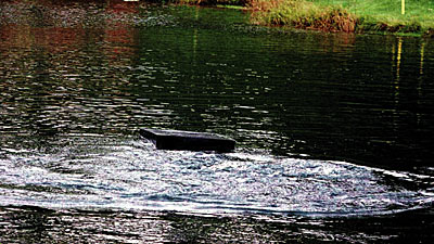 Sometimes a simple circulator moves enough water in small, shallow ponds.