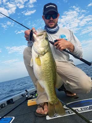 The author, with a nice June bass, caught with a deep crankbait.