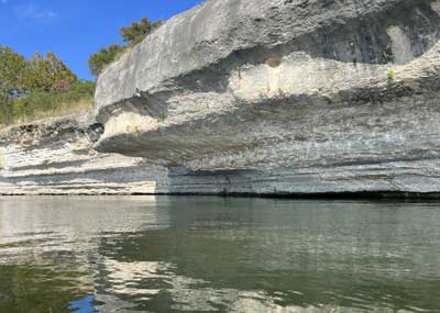 Steep bluff walls provide shade and are great places to look for bass every September.