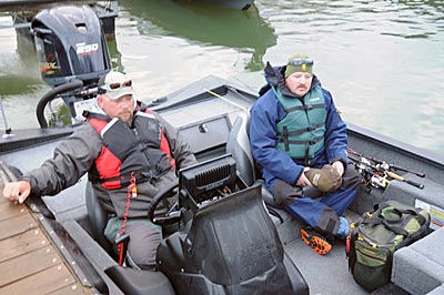 Talking with his pro partner before the tournament helps the co-angler from overloading the boat with tackle.