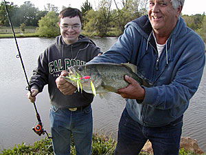 Collin Peirce on his 21st birthday with Tom and 8lb Moby (he has down syndrome)