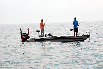 1)	Matt Straw and Scott Dobson explore a deep-water hump far removed from traditional structure for August smallmouths.