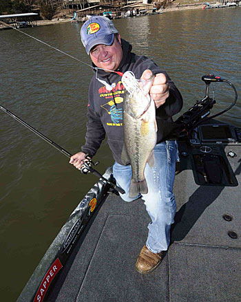 James Watson targets rocky banks to catch bass during the annual reservoir drawdown.