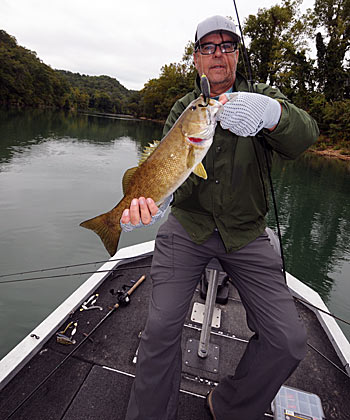 Guide Bill Smith catches river smallmouth on a variety of lures including topwater baits throughout the fall.