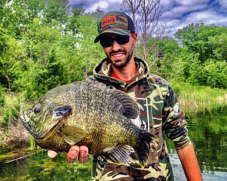 Author with a beast of a hybrid sunfish.