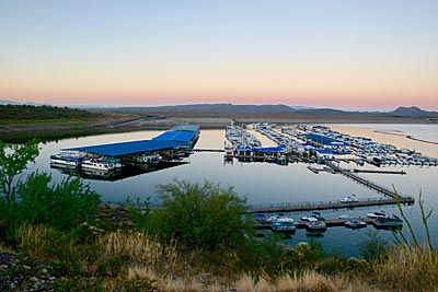 Marinas can be huge and often only separated from the main lake by a long breakwater made of tires. This one has lots of covered slips, docks, long piers, and other great places that hold fish.