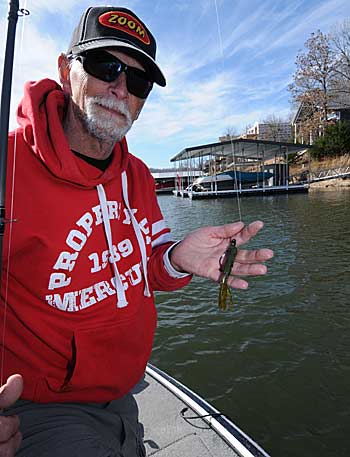 A Texas-rigged flipping tube is Harold Stark’s choice for catching inactive bass hiding in tight places.