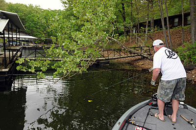 Mike Malone skips a floating worm under tree limbs and boat dock walkways to catch spawning bass.