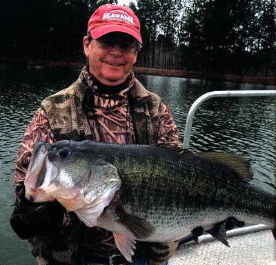 Mac Barnes with a ten-pound-plus bass raised in his Alabama all-female bass lake with plentiful gizzard shad and large bluegills.