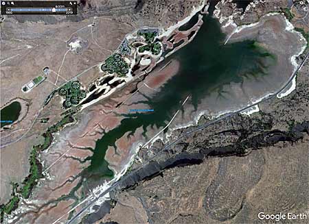 Using the historical data feature allows you to view multiple satellite images from different dates. The picture here shows roadbeds and other structures during a low water period.