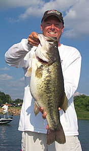 Giant bass lurk in the holes below matted grass.