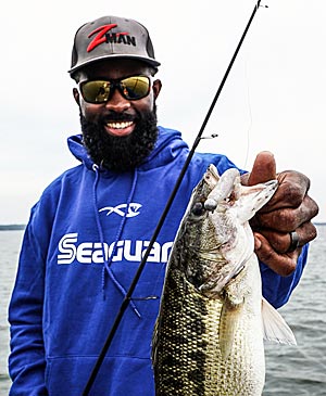 Latimer with a nice spotted bass that was fooled by a small swimbait.