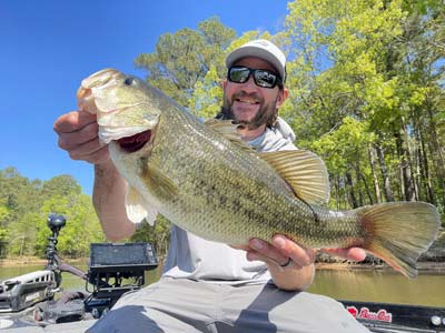 A bass caught by the author on a single isolated log on a stretch of bank.