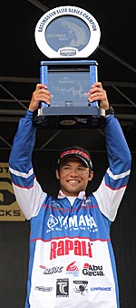 Brandon Palaniuk seizes victory at the Bull Shoals bass fishing tournament.