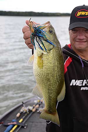 The author with a healthy bass caught on a jig.